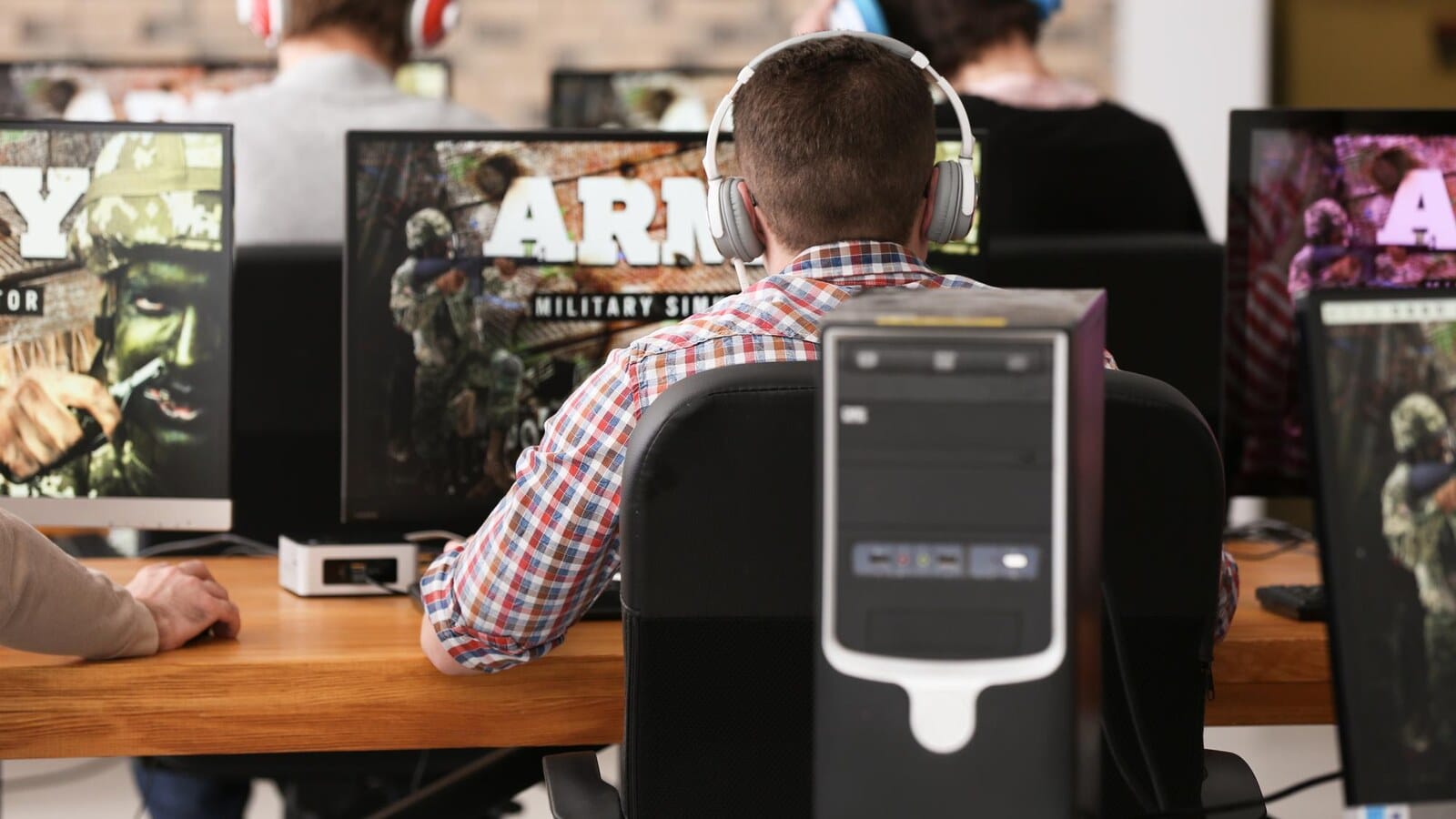 Gamer looking at a large video game library on a monitor