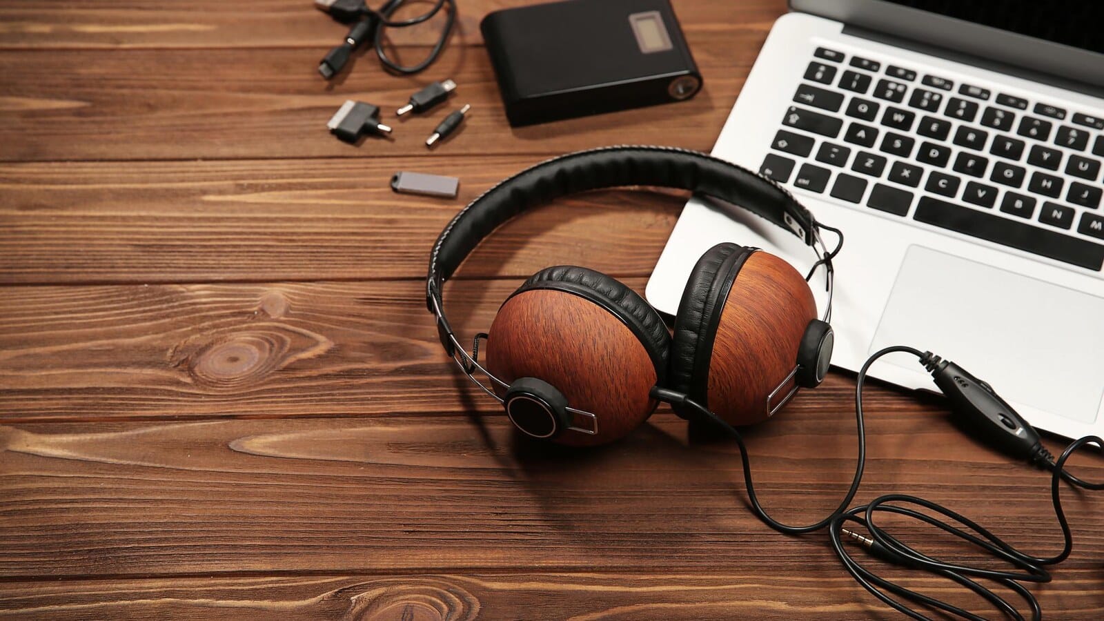 Gamer using a laptop with headphones while planning freelance work