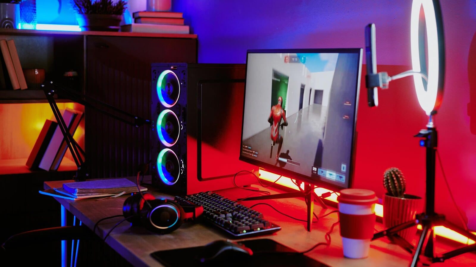 Game controller and microphone on a creator desk for recording gameplay clips